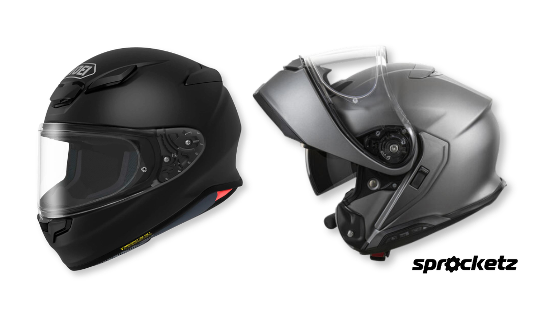A side-by-side comparison of a matte black full-face motorcycle helmet and a silver modular helmet in the open position.