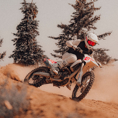 100% ARmatic Goggles - Clear Lens - Lifestyle shot of rider on white dirt bike