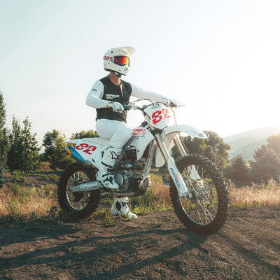 100% ARmatic Goggles - Clear Lens - Lifestyle shot of rider on white dirt bike