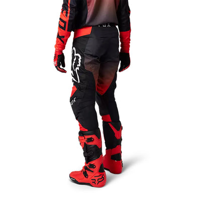 Fox Racing 180 Leed Pants Fluorescent Red - Rear Side View of Model Posing in Pants