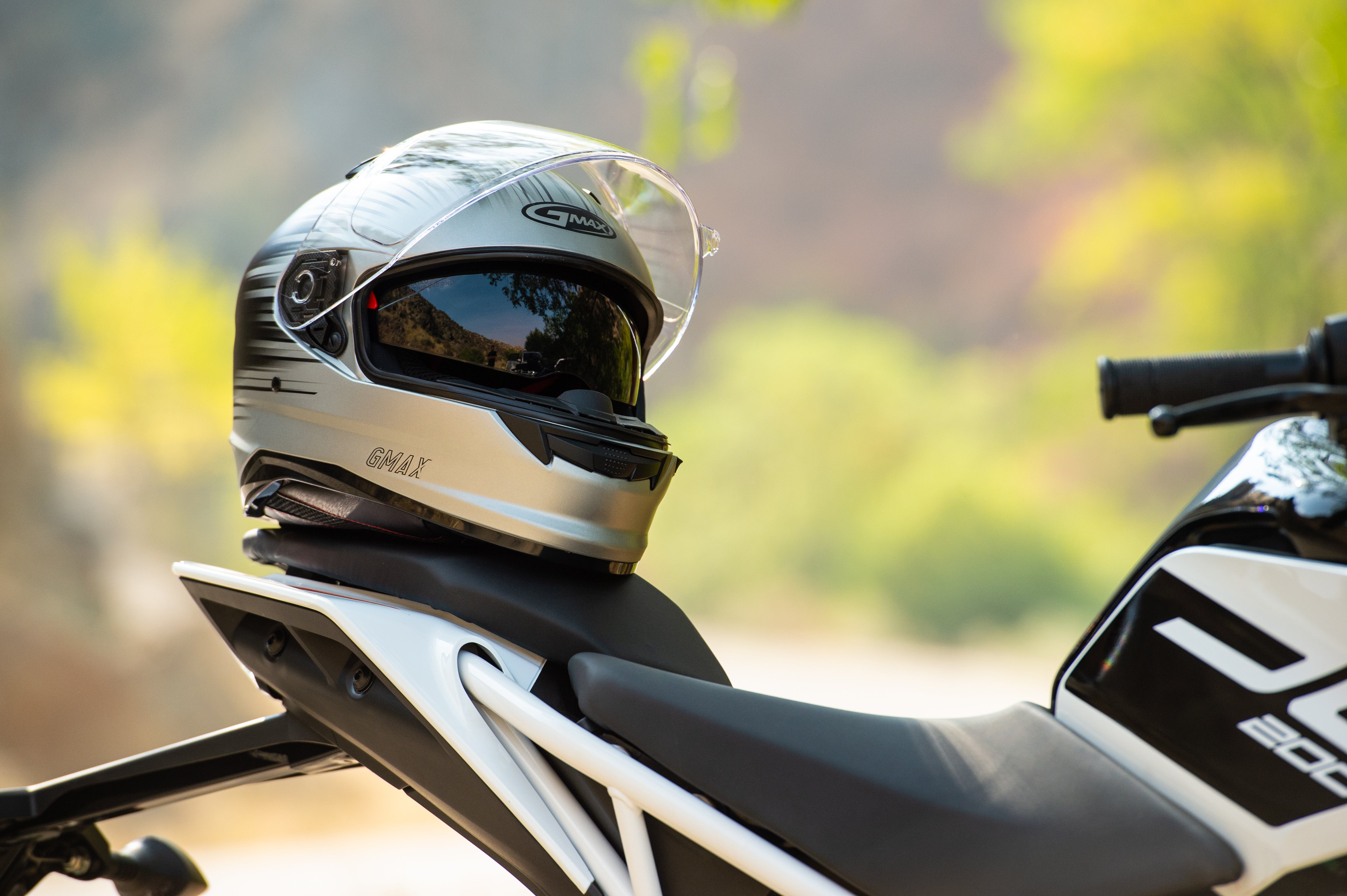 Helmet resting on back of motorcycle
