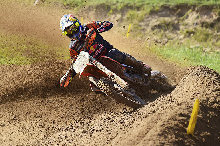 Dirt rider turning through the mud wearing Sidi Crossfire 3 Boots