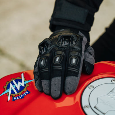 Cortech Men's Hyper-Flo 2.0 Gloves Black - Lifestyle Close-Up of gloved hand resting on red motorcycle tank