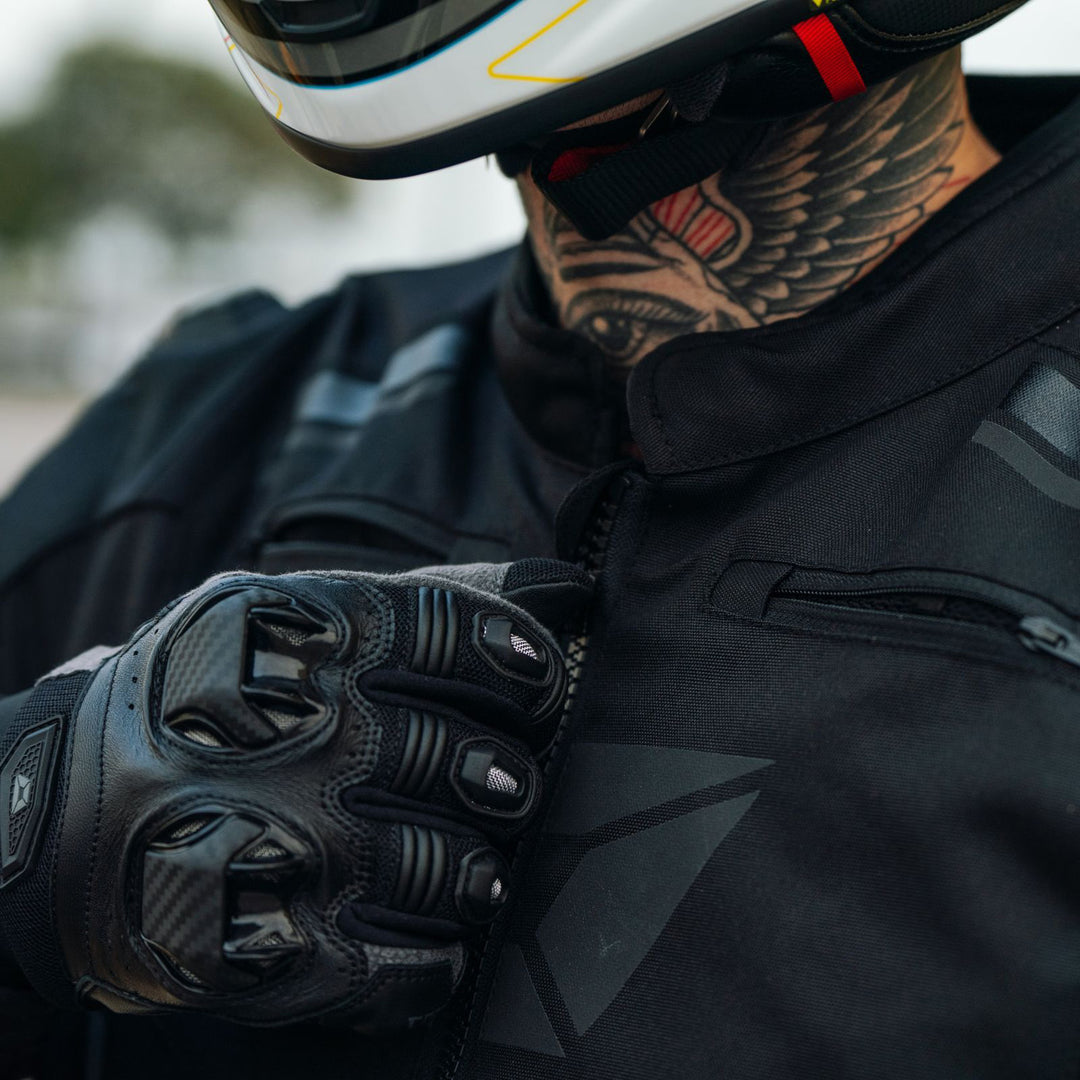 Cortech Men's Hyper-Tec 2.0 Jacket Black/White - Lifestyle Close-Up of rider zipping jacket up to neck