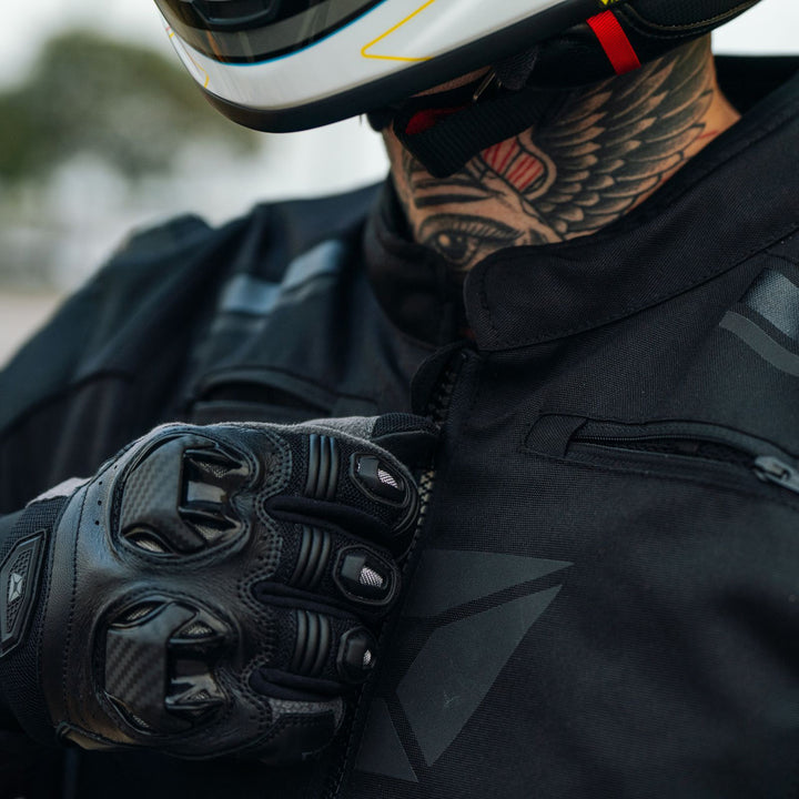 Cortech Men's Hyper-Tec 2.0 Jacket Black/White - Lifestyle Close-Up of rider zipping jacket up to neck