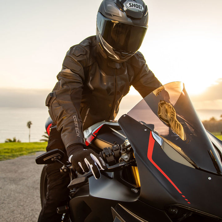 Cortech Lite Gloves Black/White - Lifestyle Shot of Rider on black motorcycle while wearing gloves
