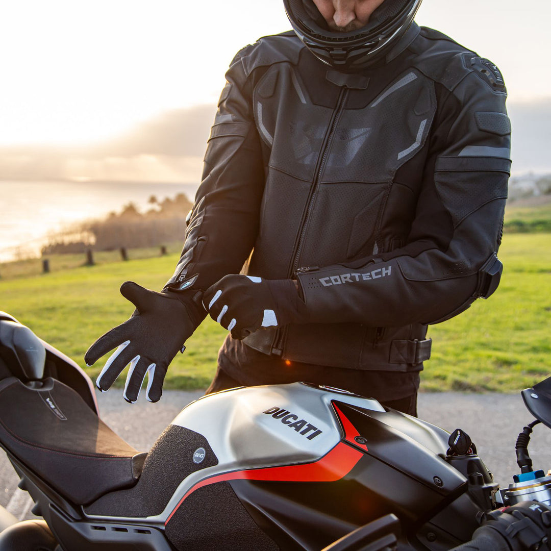 Cortech Lite Gloves Black/White - Lifestyle Shot of Rider pulling gloves on