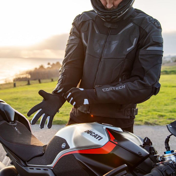 Cortech Lite Gloves Black/White - Lifestyle Shot of Rider pulling gloves on