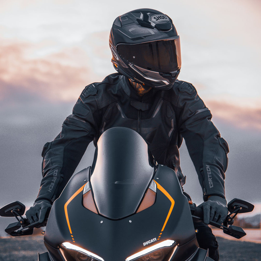 Cortech Lite Gloves Black/Black - Lifestyle Head-on Shot of Rider sitting on black motorcycle while wearing gloves