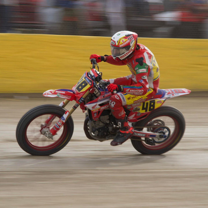 Cortech Lite Gloves Red/Black - Lifestyle Shot of Rider wearing gloves while racing flat track bike