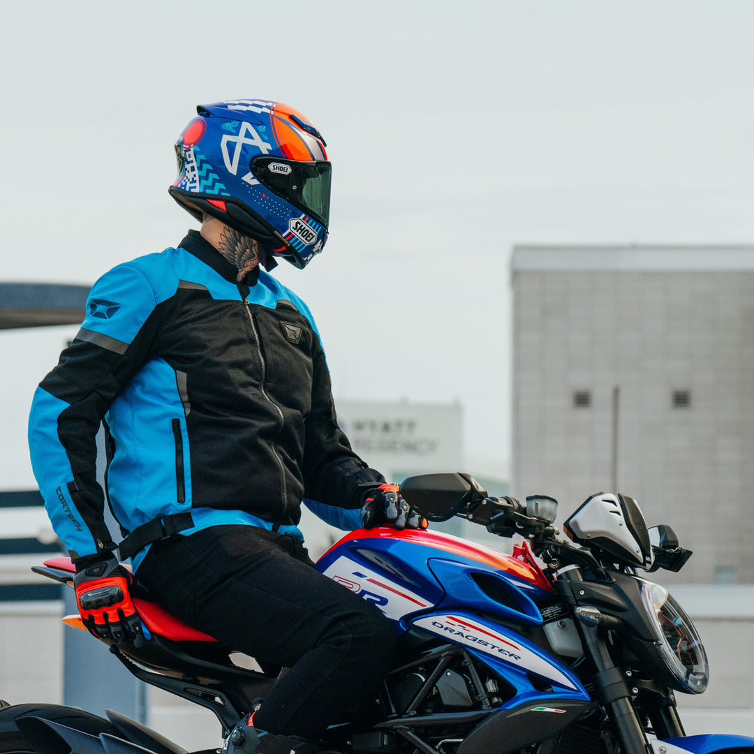 Cortech Apex Air Gloves Red - Lifestyle Shot of Rider Posing on Motorcycle While Wearing Gloves