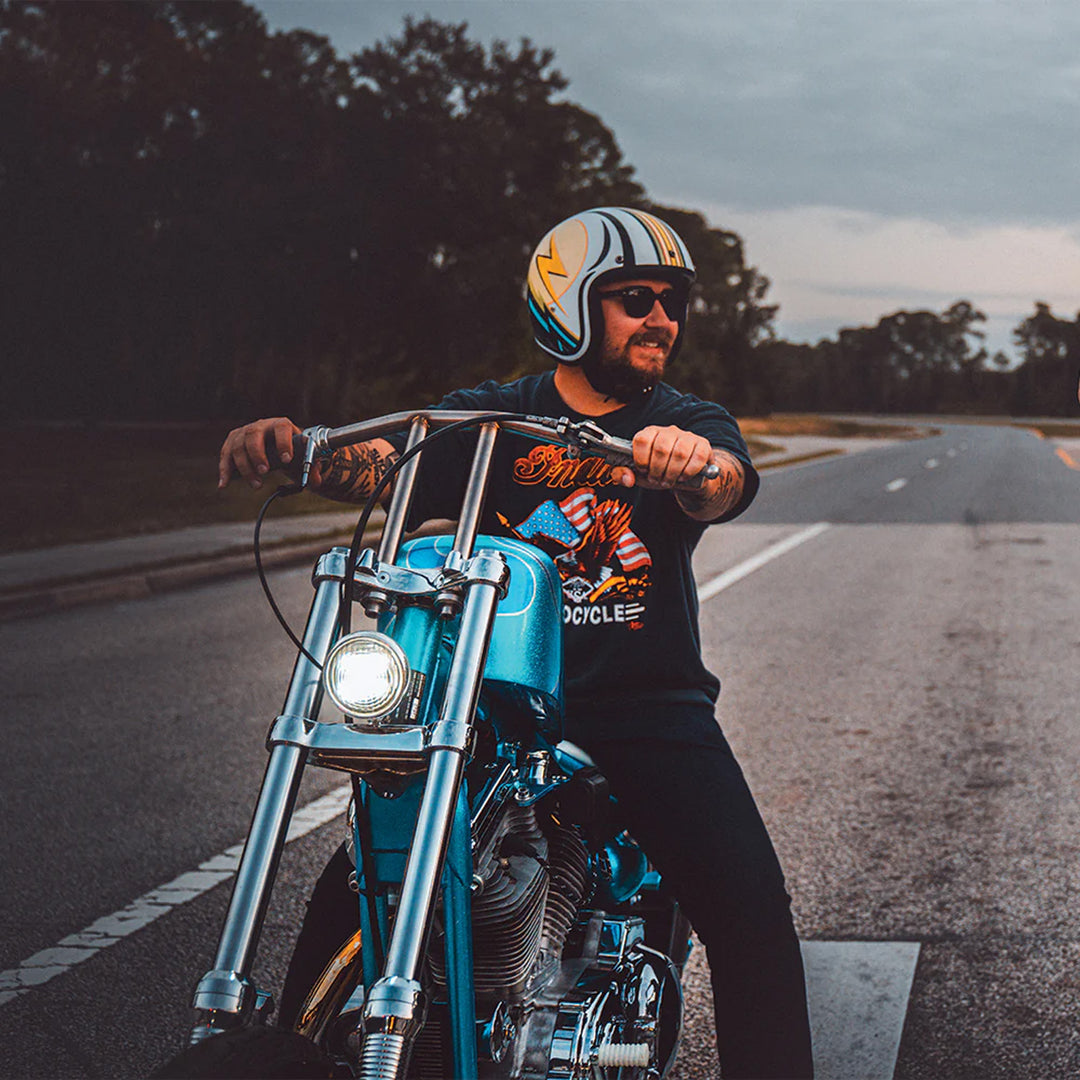 Daytona Helmets D.O.T. Cruiser Helmet - Lightning - Lifestyle Shot of Rider wearing helmet on blue chopper