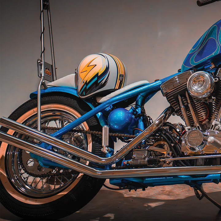 Daytona Helmets D.O.T. Cruiser Helmet - Lightning - Lifestyle shot of helmet on seat of blue chopper