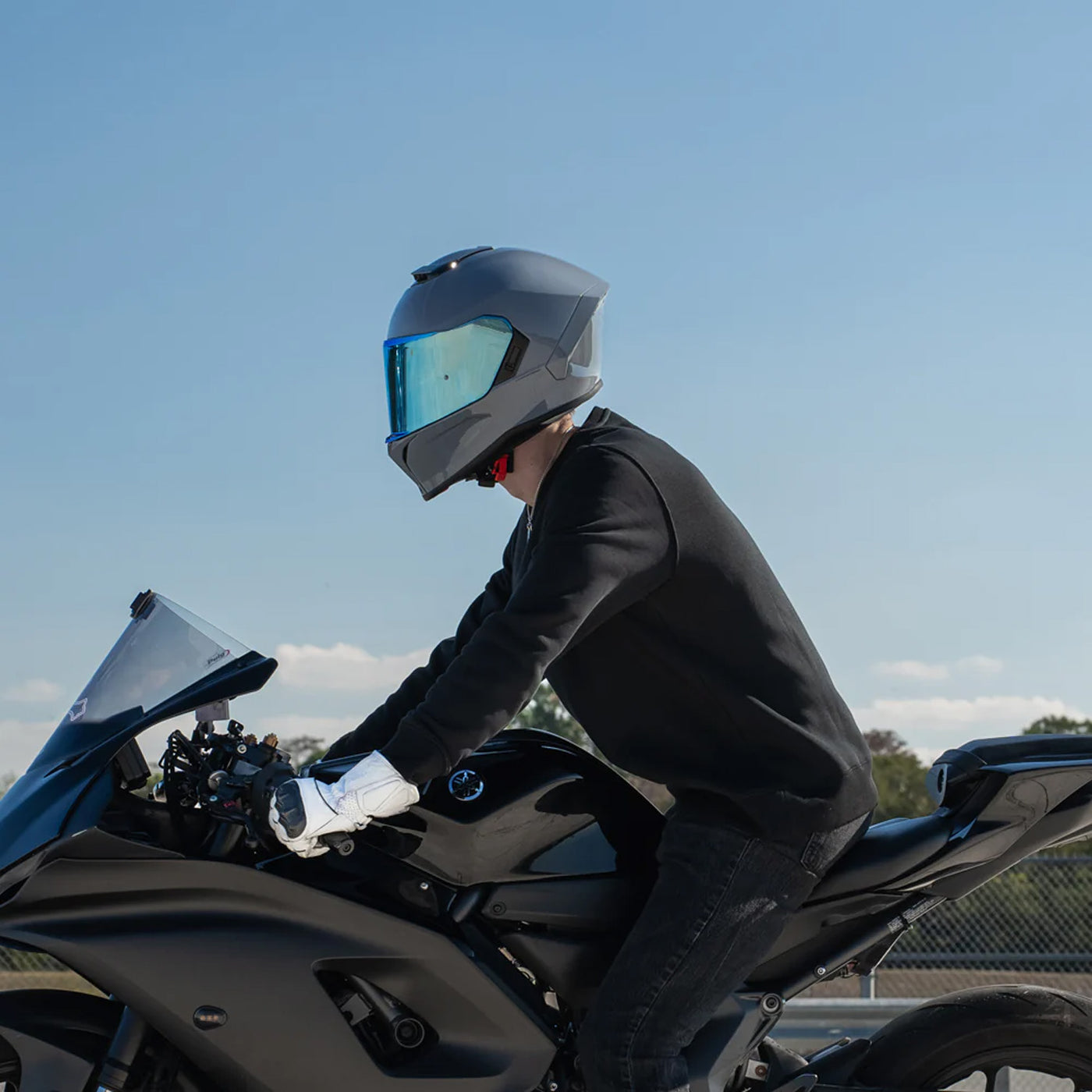 Daytona Helmets D.O.T. & ECE Viper Helmet Arctic Grey - Lifestyle of rider wearing helmet while riding on black sport motorcycle