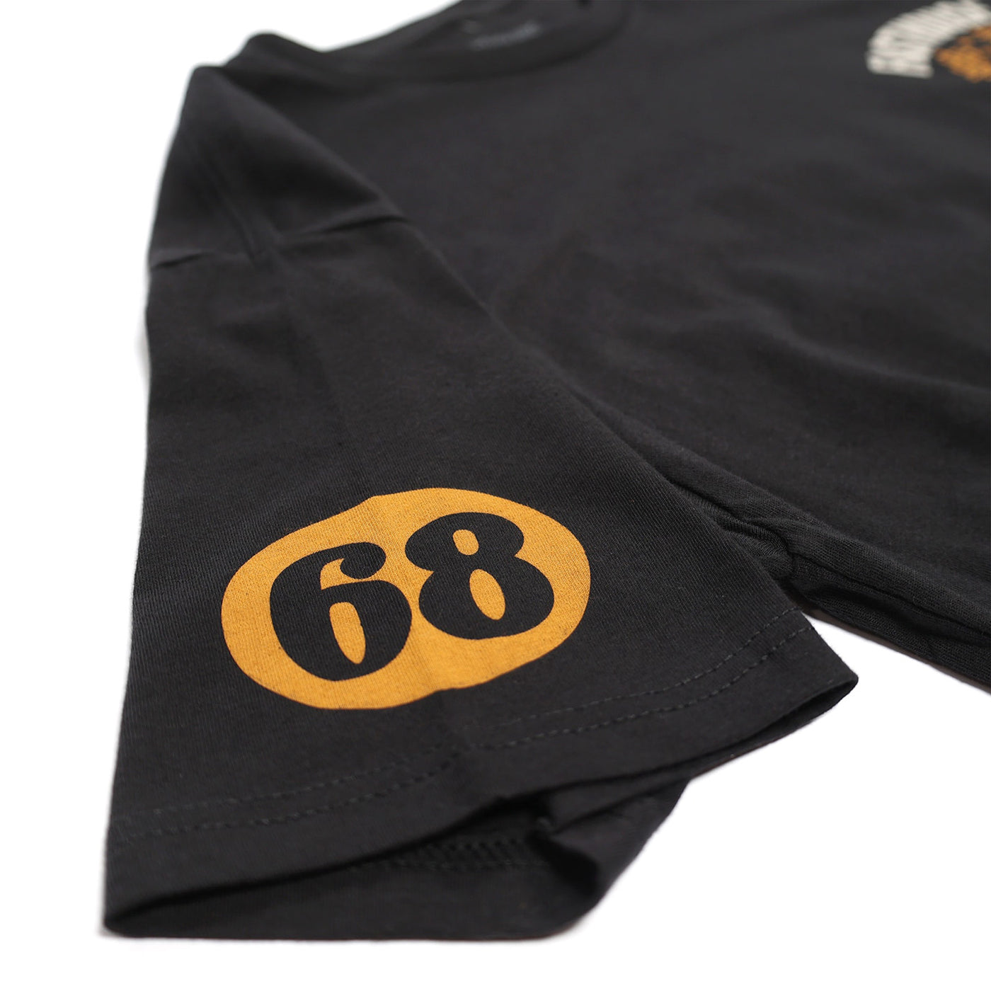 Fasthouse 68 Trick Tee Black/Gold - Close-Up of Graphic on Sleeve