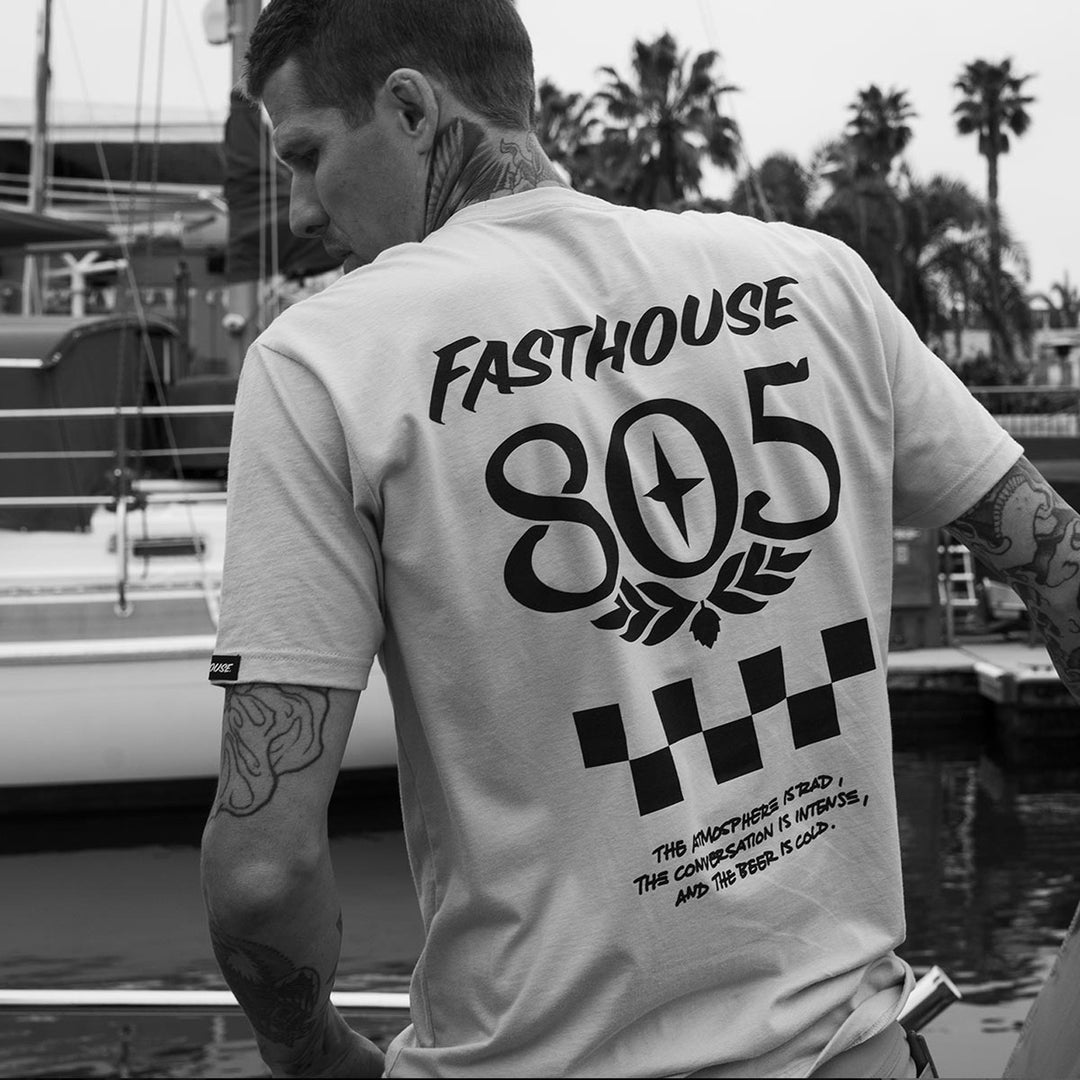 Fasthouse 805 Atmosphere Tee Light Gray - Lifestyle Shot of Back of Man Posing in Shirt on Wharf