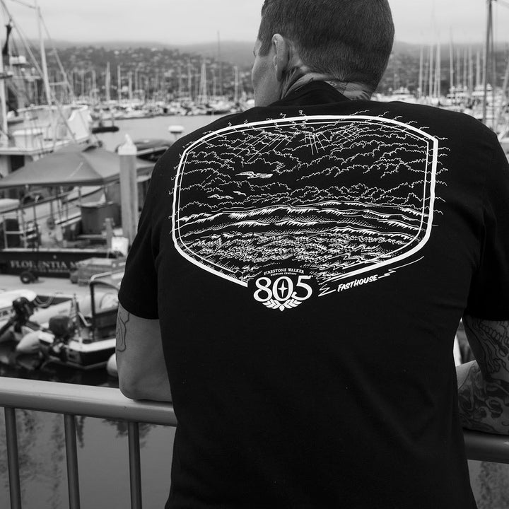 Fasthouse 805 Dawn Patrol Tee Black - Lifestyle Shot of Man wearing shirt overlooking wharf