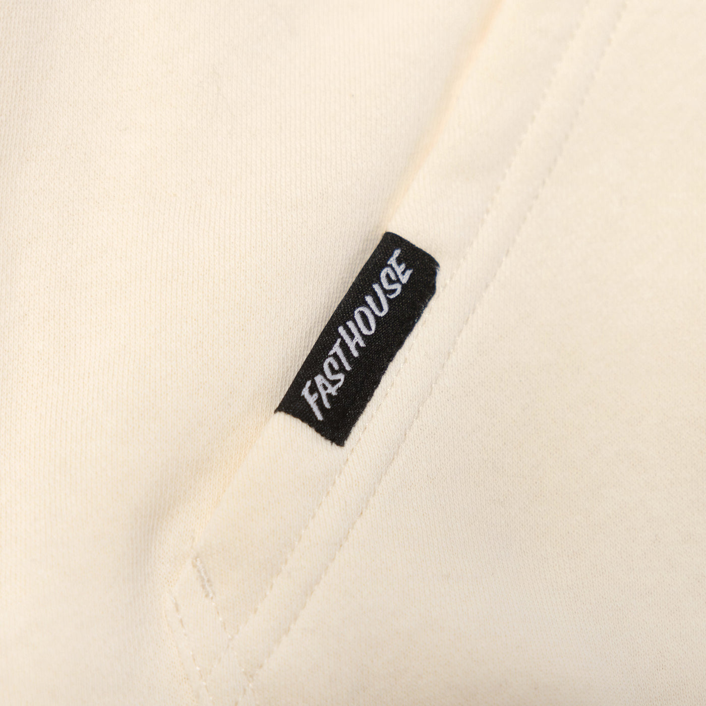 Fasthouse Base Camp Hooded Pullover Sandstone - Close-Up of Sewn-In Tag on Pocket