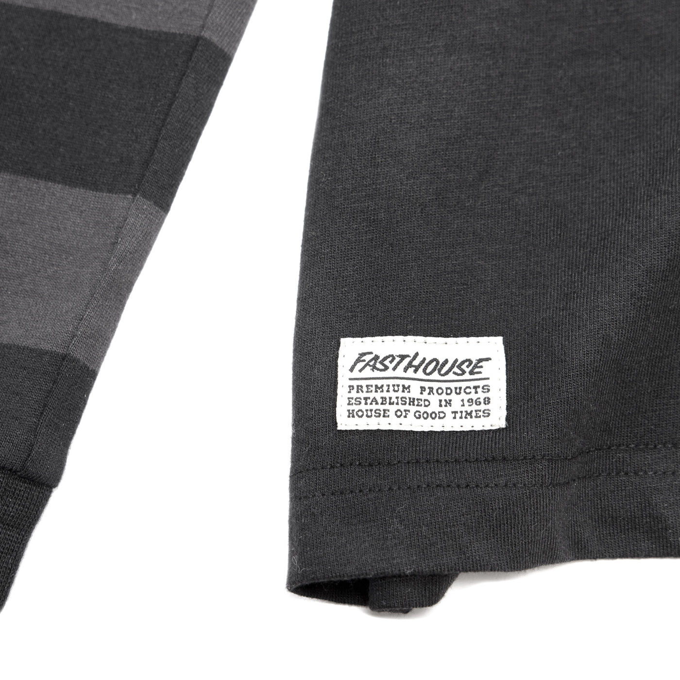 Fasthouse Blackout Yarn Dye LS Tee Black - Close-Up of Logo Tag on Front Hem