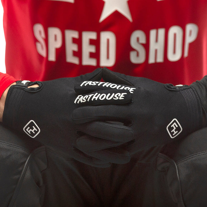 Fasthouse Carbon Glove Black - Close-Up of gloved hands with fingers entwined