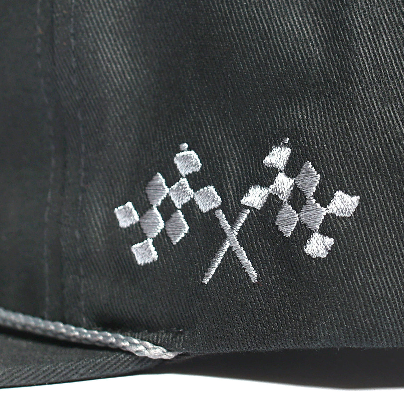 Fasthouse Carrera Hat Black - Close-Up of Stitched Logo on Side