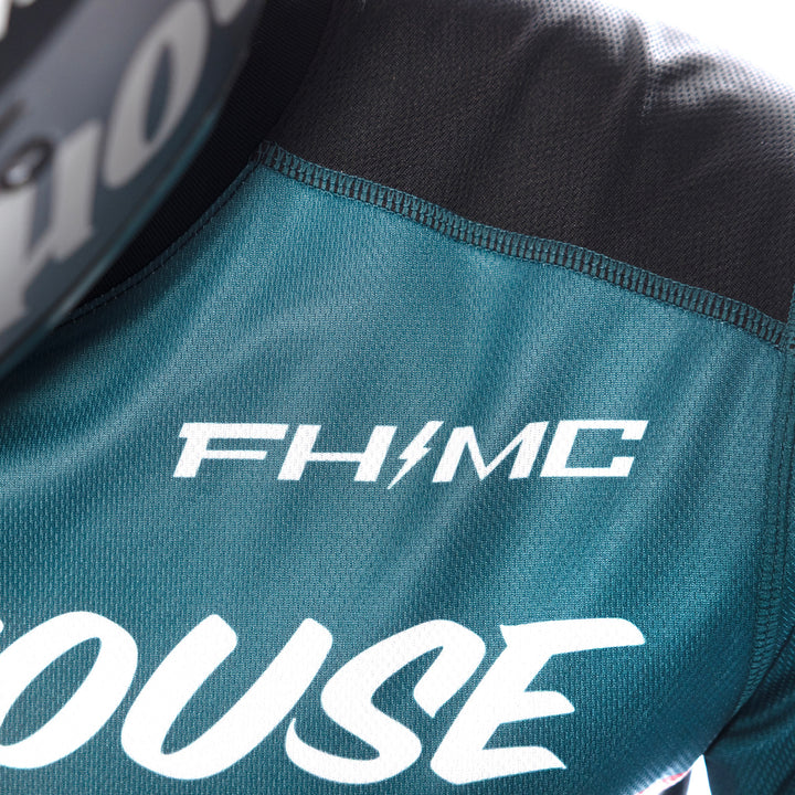 Fasthouse Carbon Force Jersey Teal - Close-Up of Front Left Shoulder Graphics