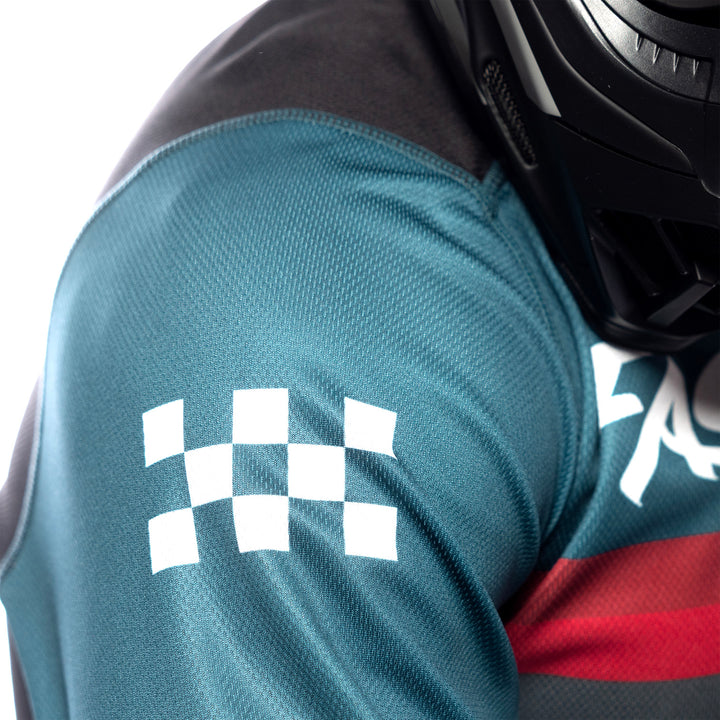 Fasthouse Carbon Force Jersey Teal - Close-Up of Upper Right Sleeve Graphics