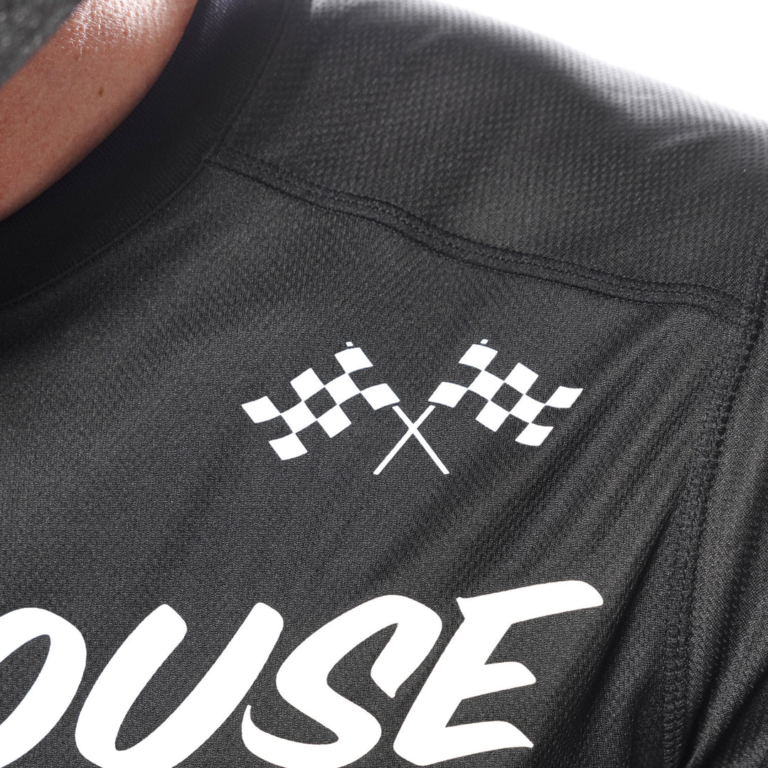 Fasthouse Carbon Method Jersey Black/Gray - Close-Up of Front Left Shoulder Graphic