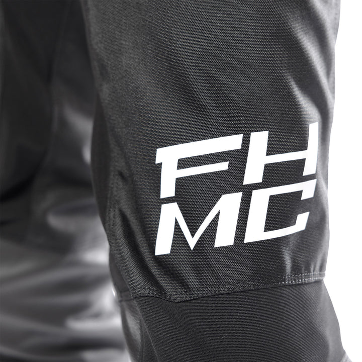 Fasthouse Carbon Method Pants Black - Close-Up of Lower Left Thigh Graphics