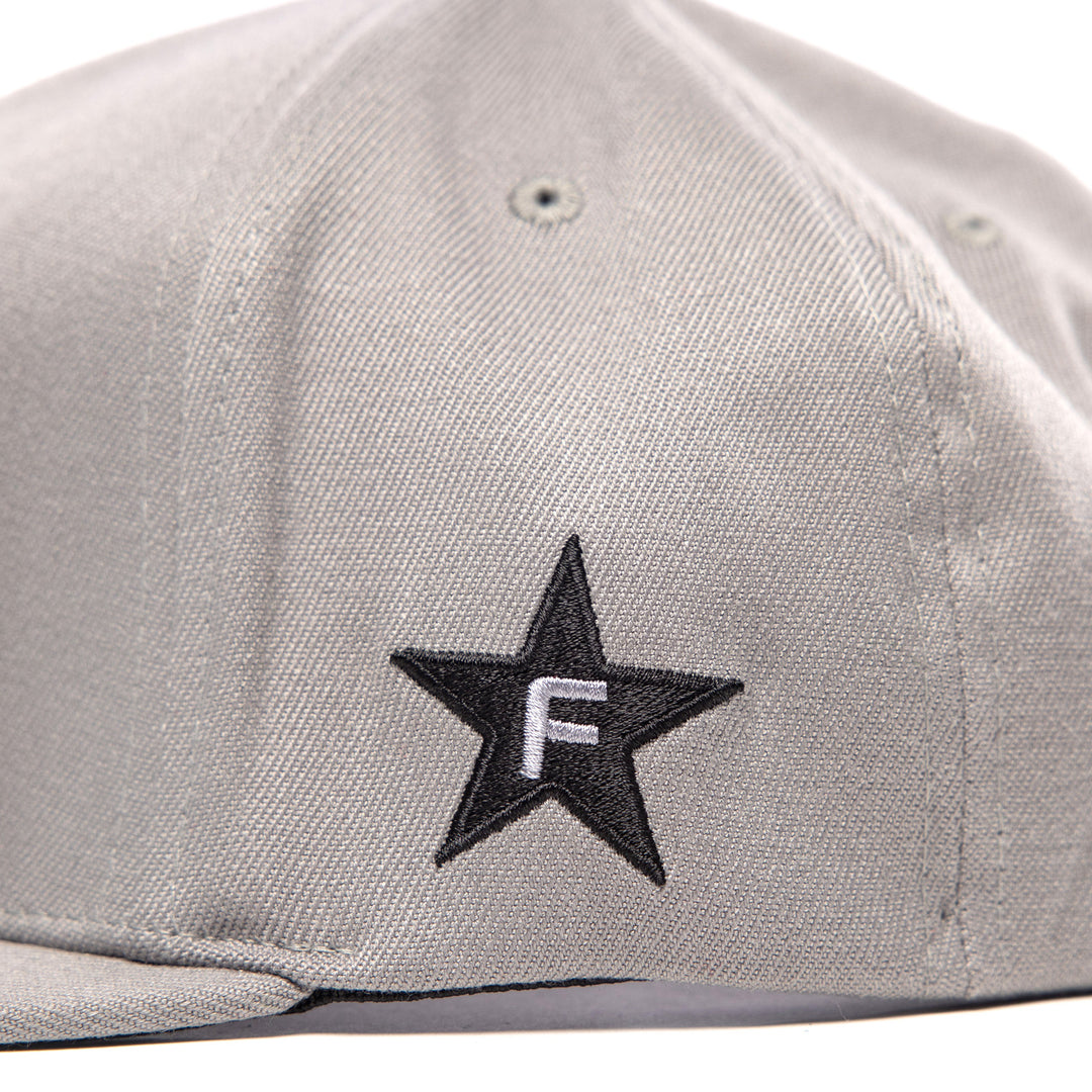 Fasthouse Crown Hat Gray - Close-Up of Side Stitched Graphic