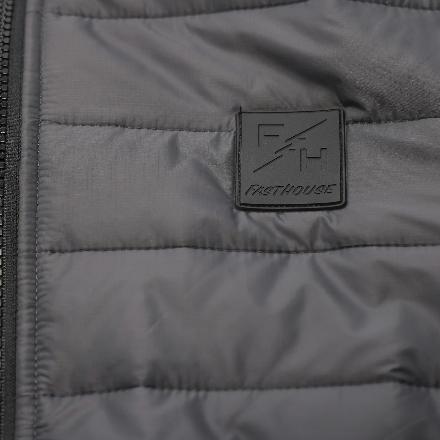 Fasthouse Crosswind Packable Puffer Jacket Charcoal - Close-Up of Logo on Front