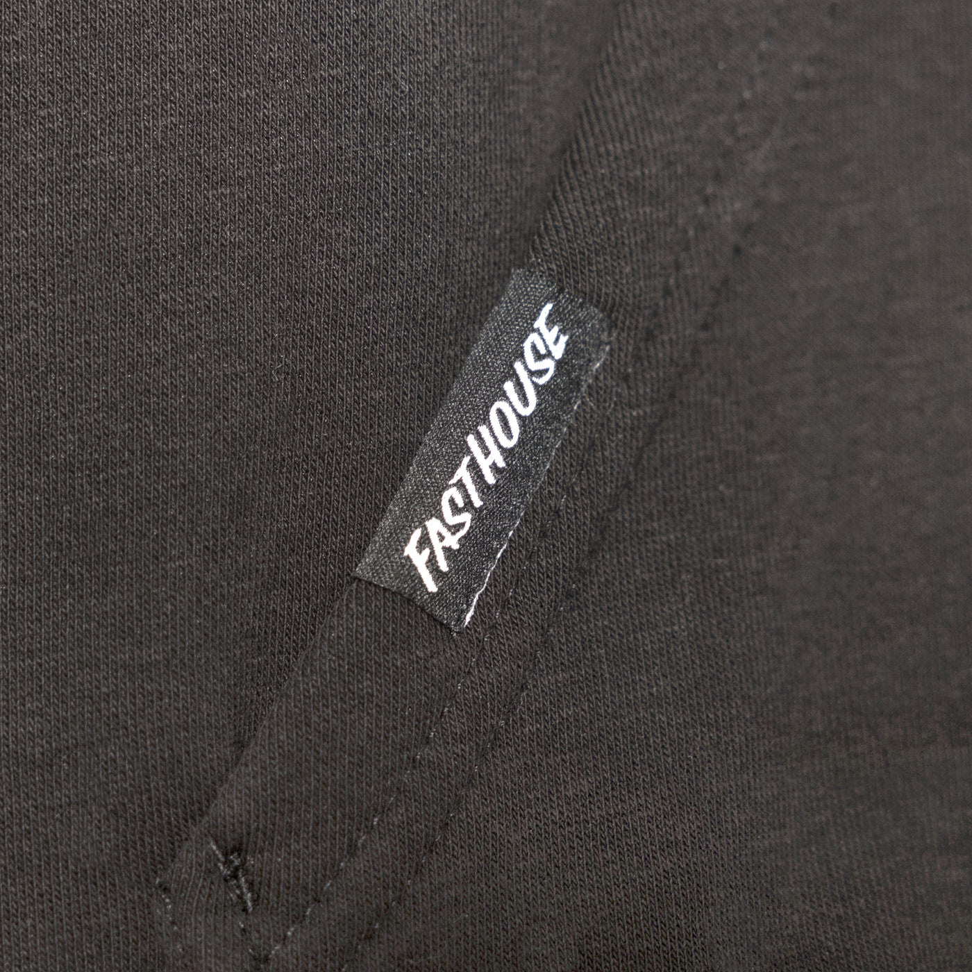 Fasthouse Dash Hooded Pullover Black - Close-Up of Sewn-In Tag on Pocket