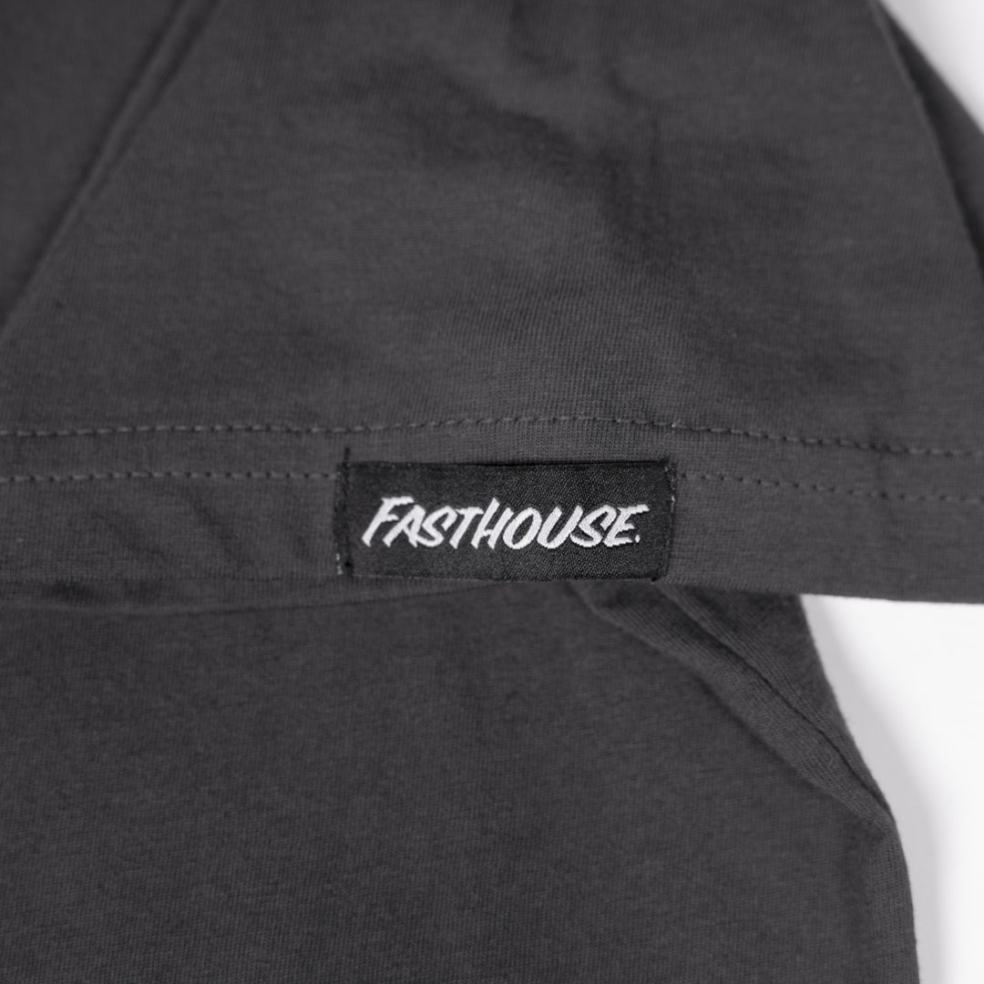 Fasthouse Dispatch SS Tee Graphite Black - Close-Up of Logo Tag on Sleeve