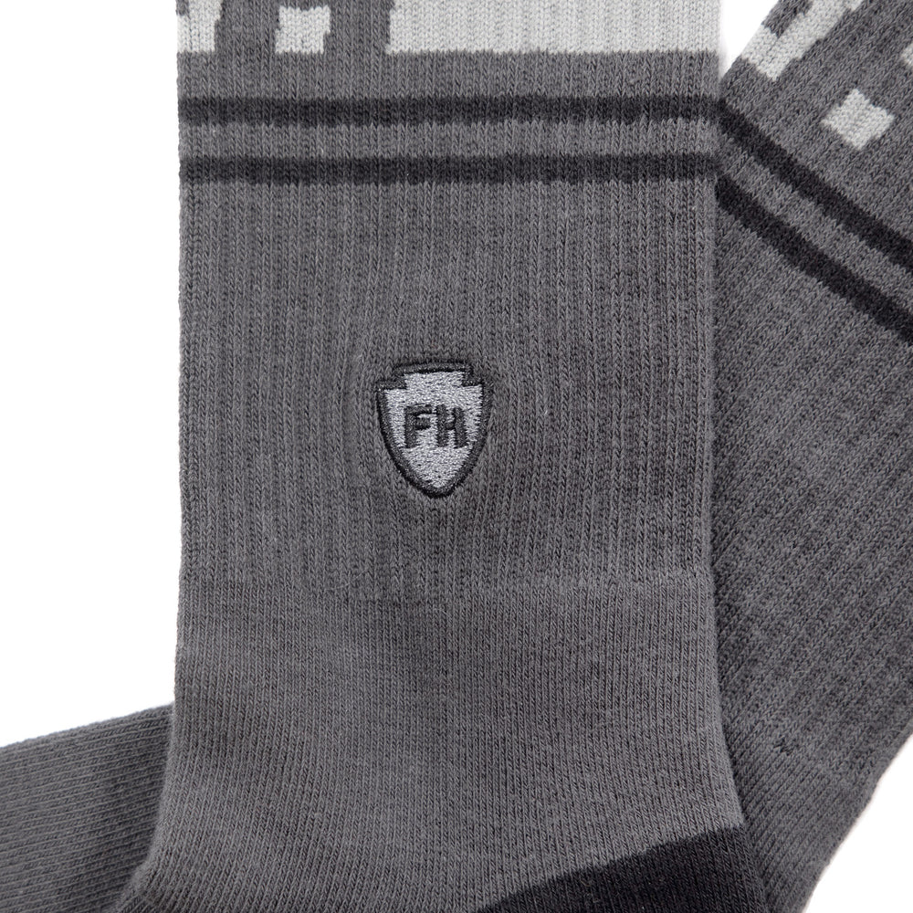 Fasthouse Dozer Crew Socks Dark Gray - Close-Up Side View of Stitched Logo