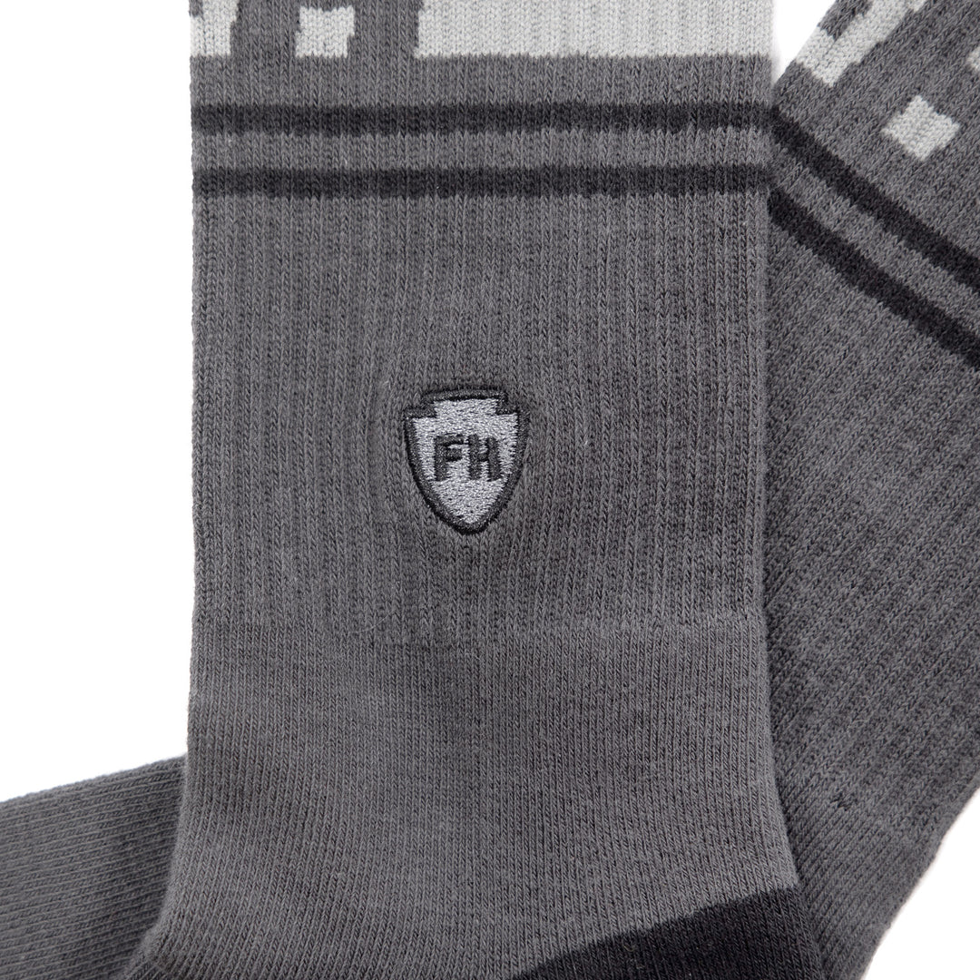 Fasthouse Dozer Crew Socks Dark Gray - Close-Up Side View of Stitched Logo