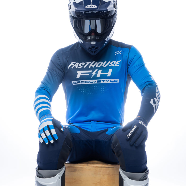 Fasthouse Elrod Ether Jersey Electric Blue/Navy - Front View of Model Sitting While Wearing Jersey