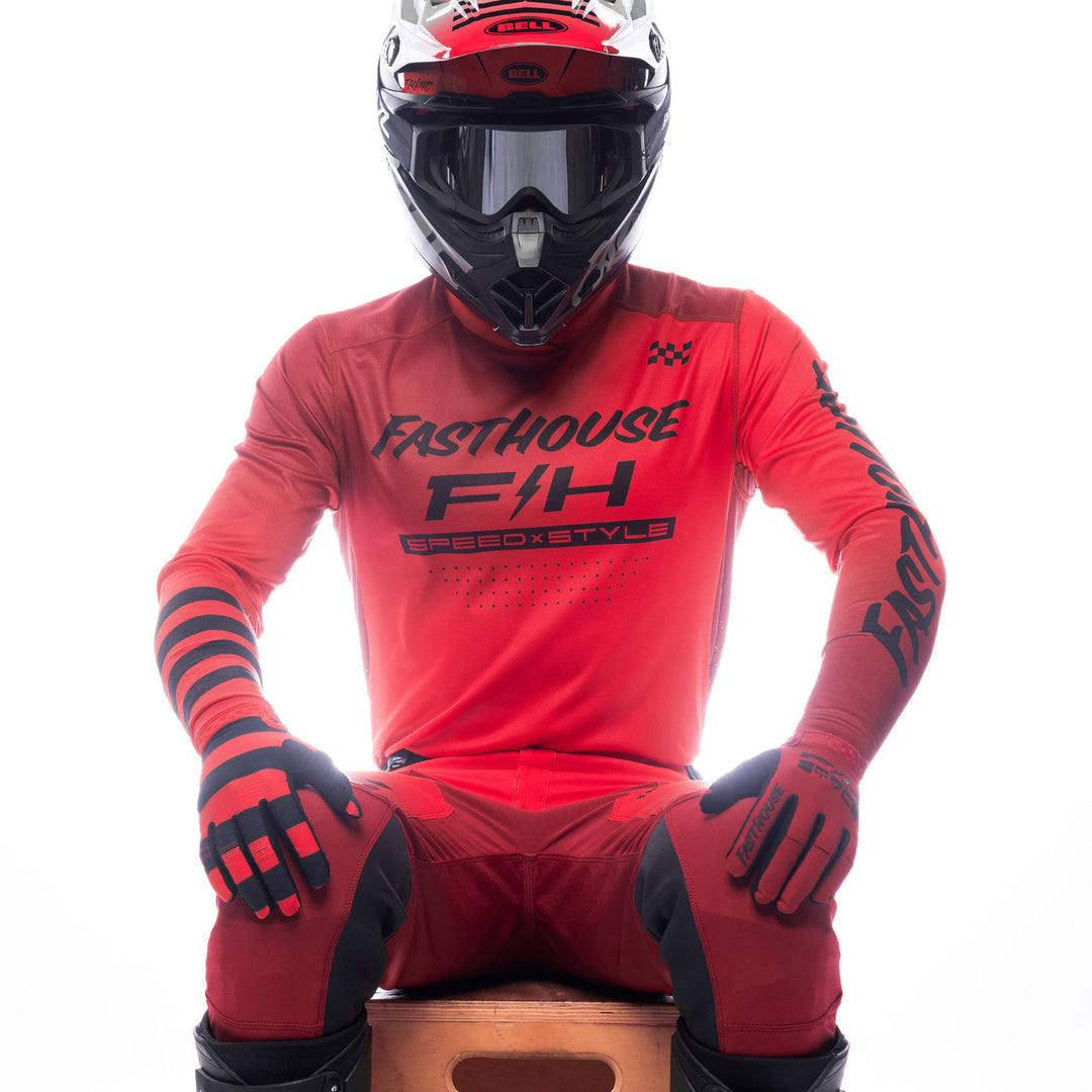 Fasthouse Elrod Ether Jersey Red/Jester Red - Front View of Model Sitting While Wearing Jersey