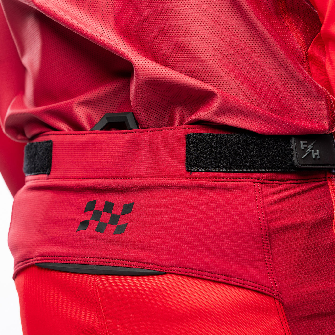 Fasthouse Elrod Ether Pants Red/Jester Red - Close-Up of Right Side Waist Graphic