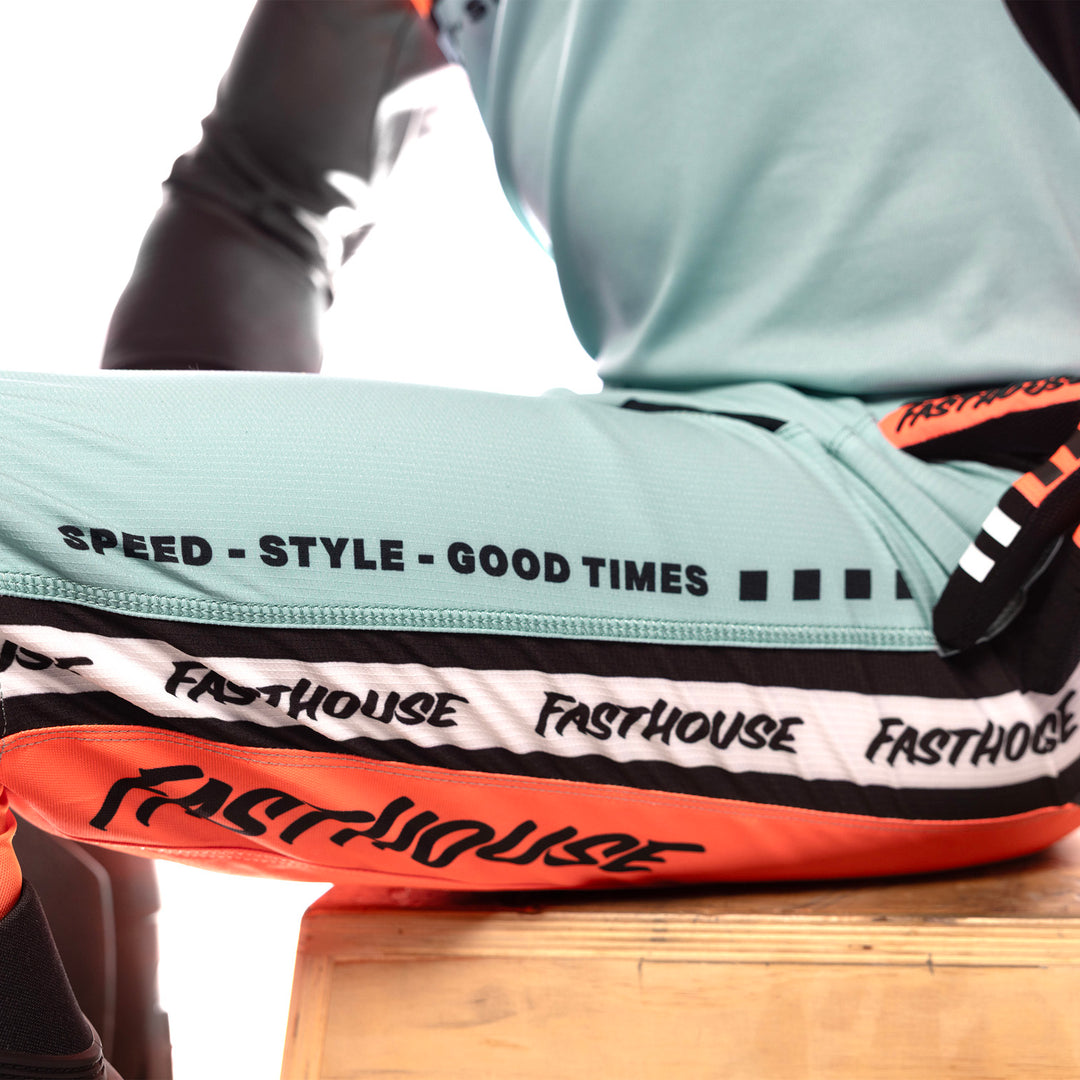 Fasthouse Elrod Formula Pants Oceanic Mint/Hyper Coral - Close-Up of Left Thigh Graphics
