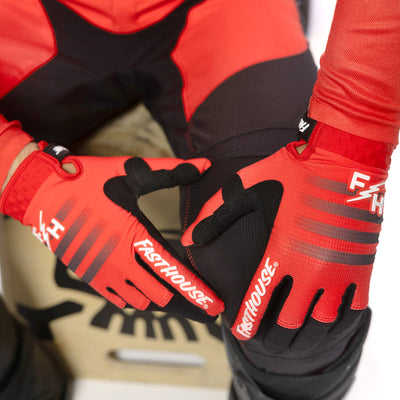 Fasthouse Elrod Hypersonic Gloves Red - Close-Up of Gloved Hands resting on knee