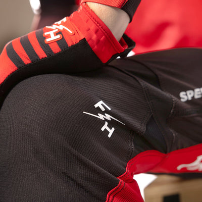 Fasthouse Elrod Hypersonic Pant Red - Close-Up of Knee Graphic