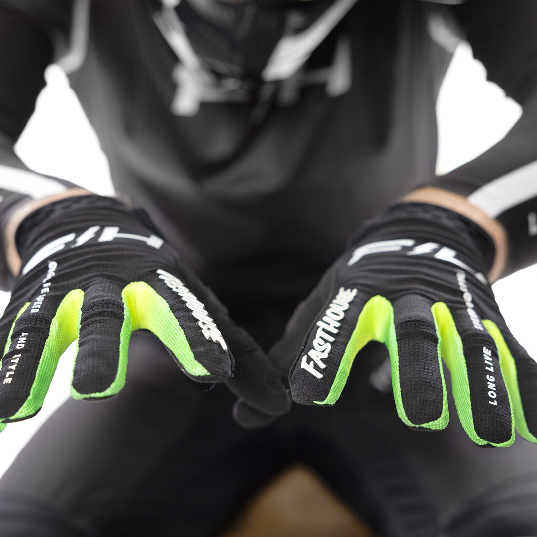 Fasthouse Elrod Nitro Gloves Black Neon - Close-Up of Model Wearing Gloves, Holding Hands Up with Fingers Spread towards Camera