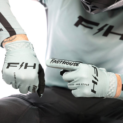 Fasthouse Elrod Nitro Gloves Oceanic Mint - Close-Up of Model Wearing Gloves, Left Hand Pointing at Back of Right Hand