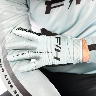 Fasthouse Elrod Nitro Gloves Oceanic Mint - Close-Up of Model Wearing Gloves, Holding Left Hand Over Right Arm