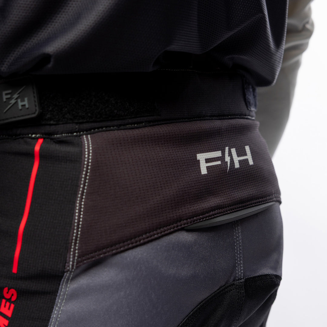 Fasthouse Elrod Storm Pants Fog/Black - Close-Up of Rear Waist Graphic