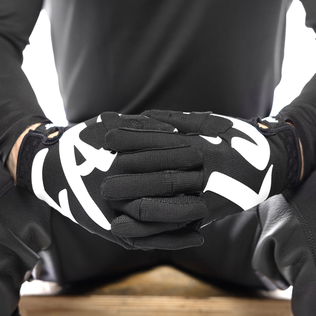 Fasthouse Elrod Torque Gloves Black - Close-Up of Model Wearing Gloves, Fingers Entwined
