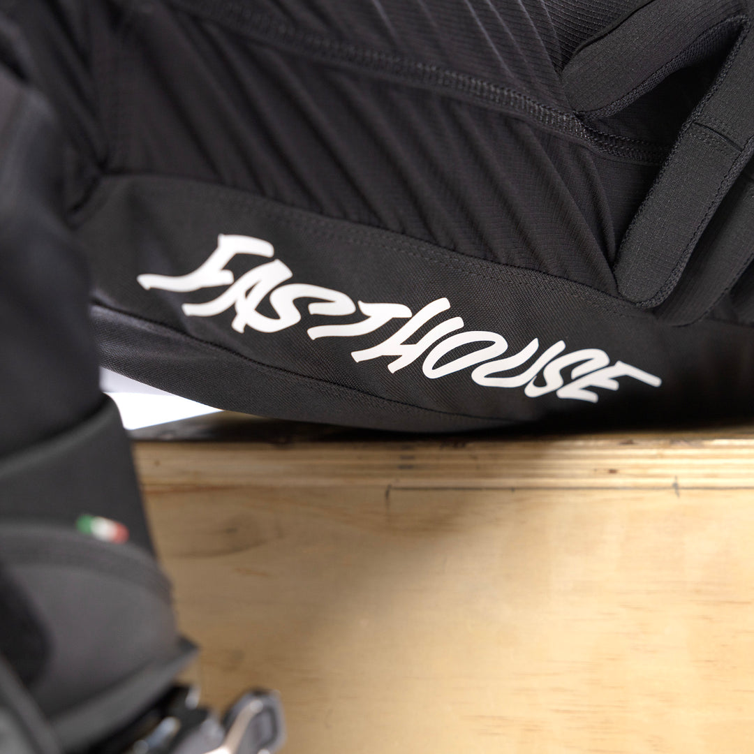 Fasthouse Elrod Torque Pants Black - Close-Up of Left Thigh Graphics