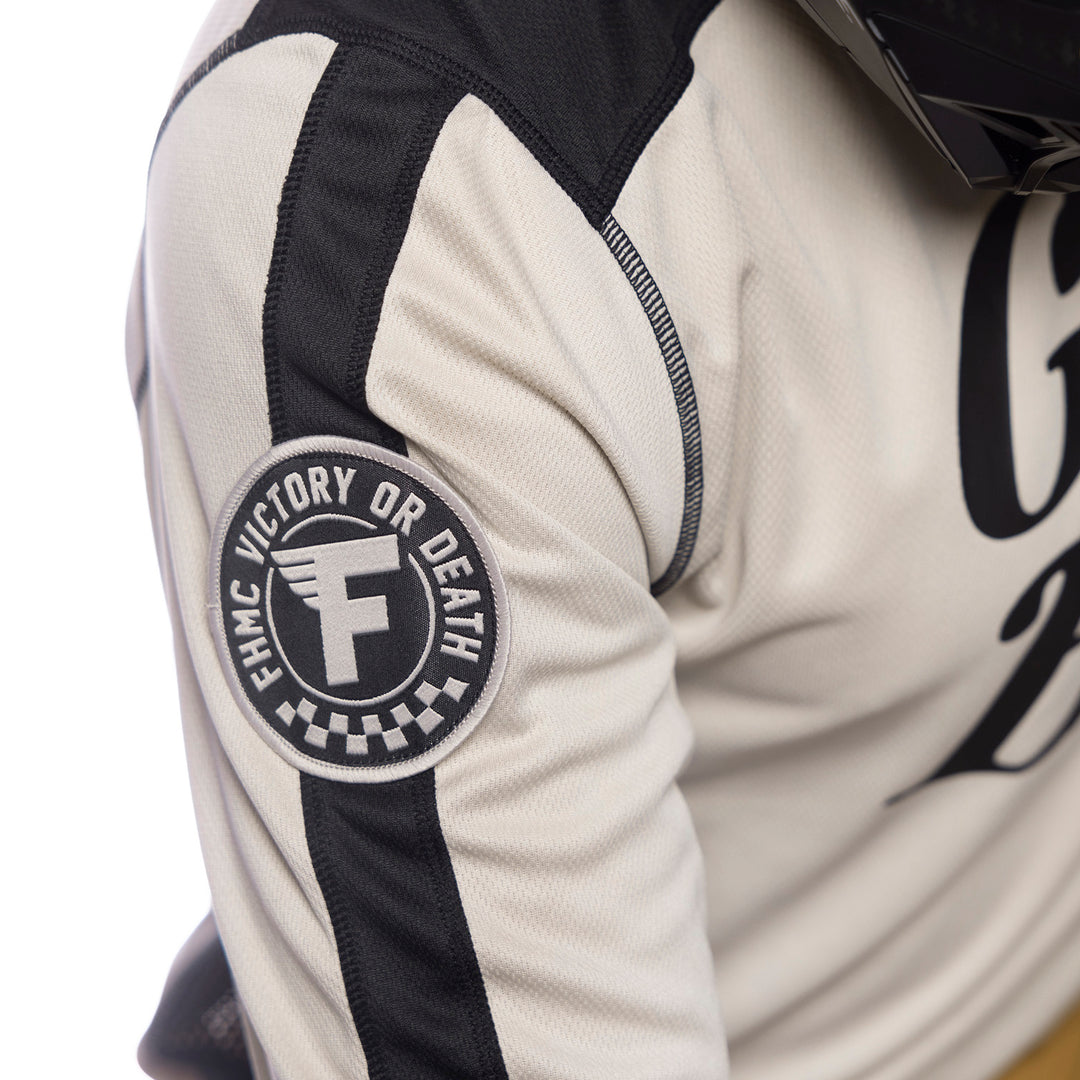 Fasthouse Grindhouse Draft Jersey Cream - Close-Up of Shoulder Sleeve Graphic