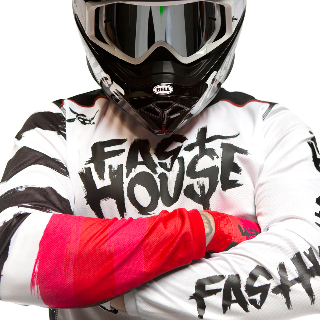 Fasthouse Grindhouse Jester Jersey White - Front View of Model Wearing Jersey with Arms Crossed Over Chest