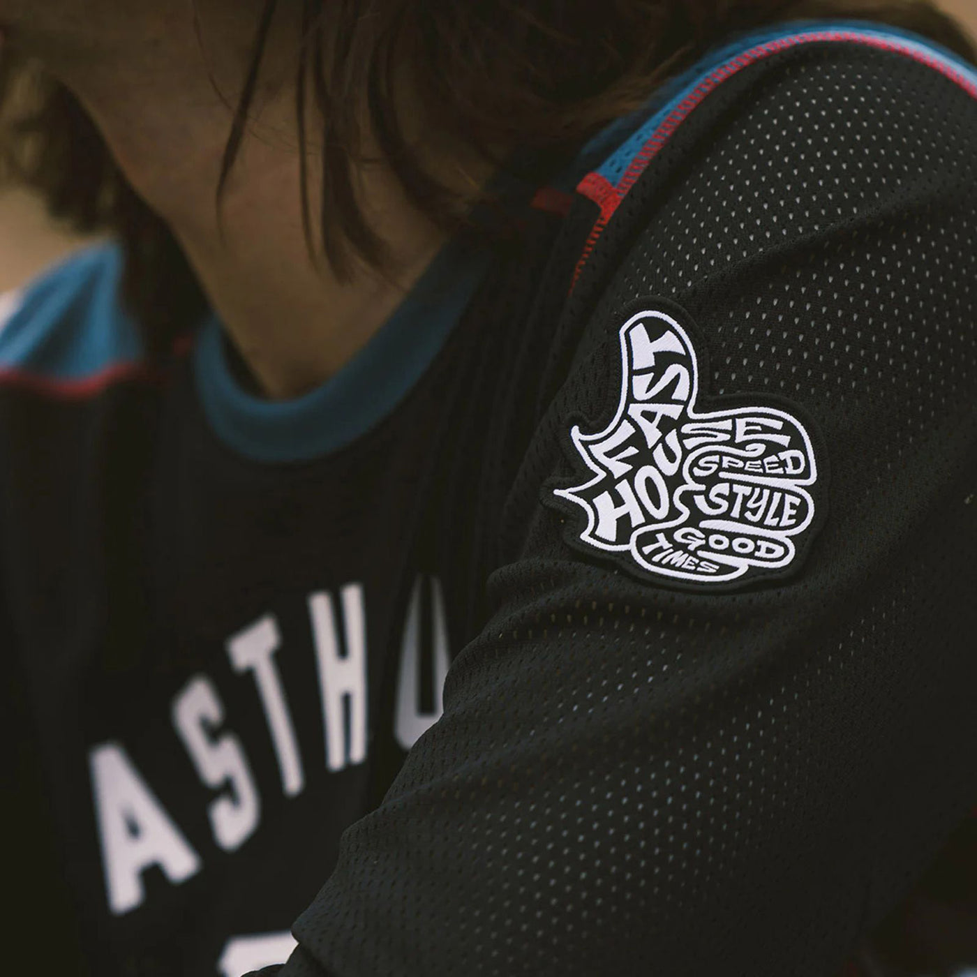 Fasthouse Grindhouse Air-Cooled Club Jersey Black/Teal - Lifestyle Close-Up of Left Sleeve Patch